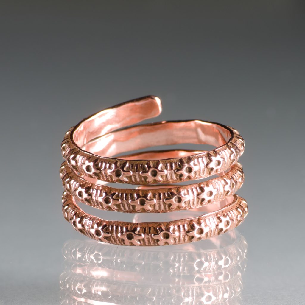 copper wrap ring with embossed flower pattern