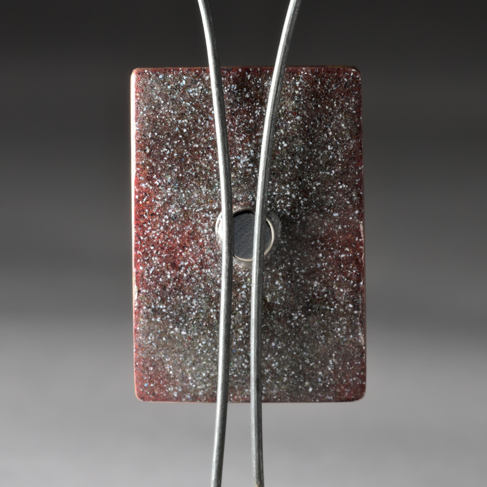 back view of abstract water symbol art magnet